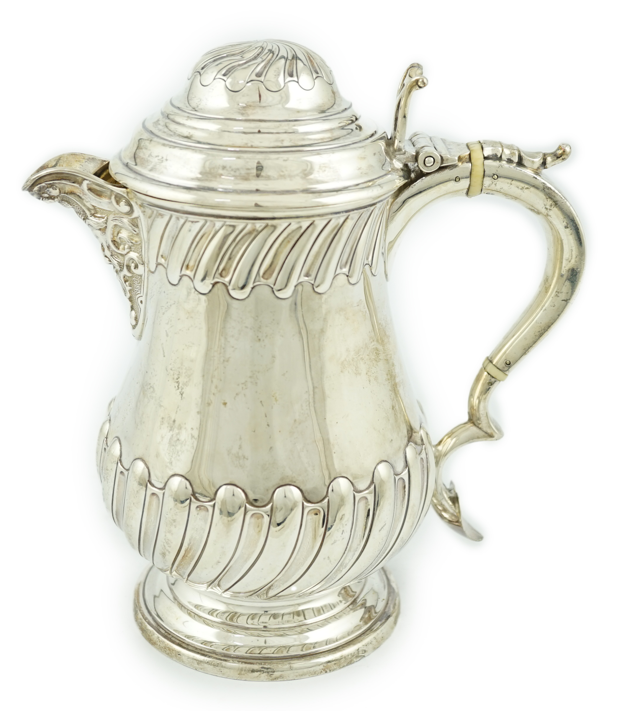 A late Victorian demi fluted wrythened silver hot water pot, by Thomas Bradbury & Sons, CITES Submission reference 8TFTTCSJ